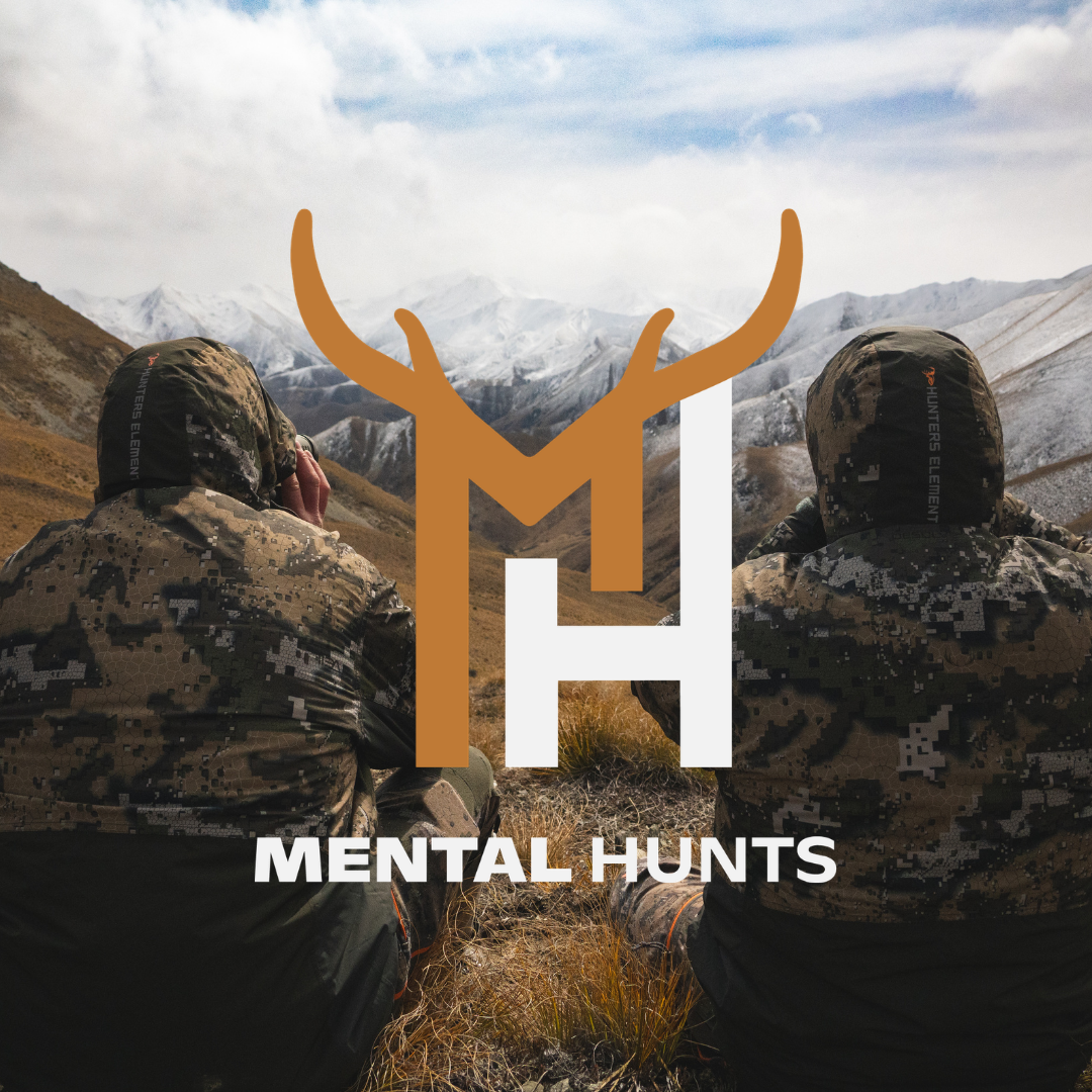Two people in camouflage sitting on a mountain with 'Mental Hunts' logo overlay.